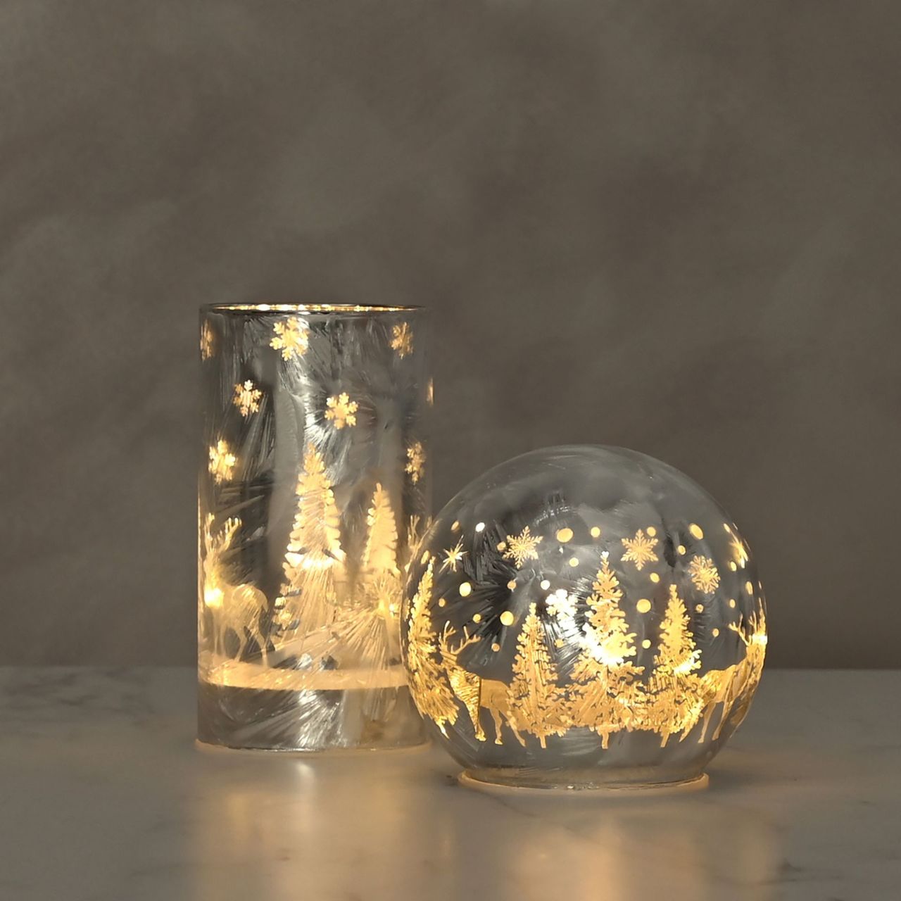 Frosted Reindeer Christmas Forest Scene Small LED Tube Light  A Frosted Reindeer LED tube light.  This illuminating decoration is a delightful twist on the traditional this Christmas.