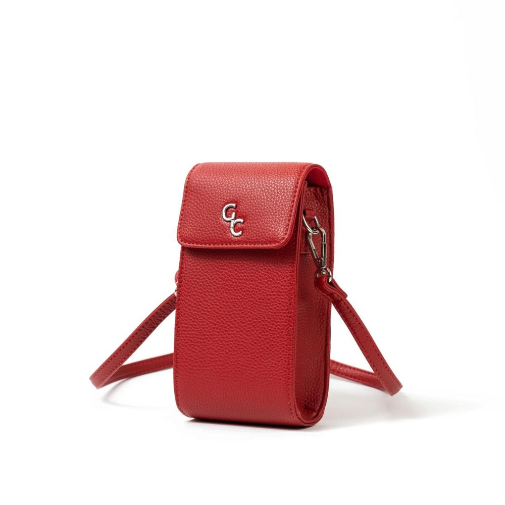 Galway Crystal Fashion Mini Crossbody Handbag - Red  Introducing the new must have accessory that is truly functional. Our Lightweight, Slim, Sleek, Crossbody bag is designed to hold the most essential accessory: Your mobile phone. There is nothing more liberating than carrying a lightweight bag that carries your essentials.