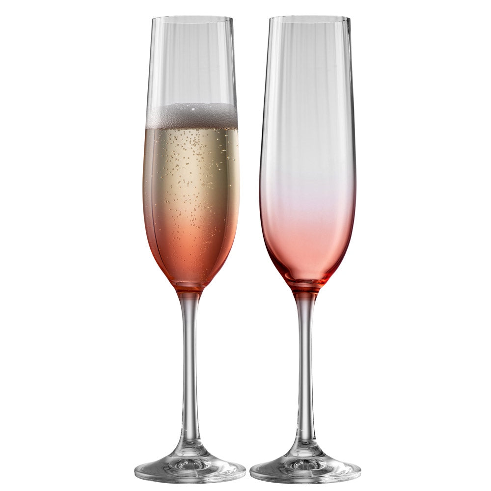 Galway Crystal Erne Champagne Flute Glass Pair Blush  These beautifully crafted Galway Crystal flute glasses with a blush coloured base are essential glasses for your home and are designed for fine Champagne lovers. The elegant shape of the glass along with the Erne pattern displays light lines along the body adding a stylish and modern finish.