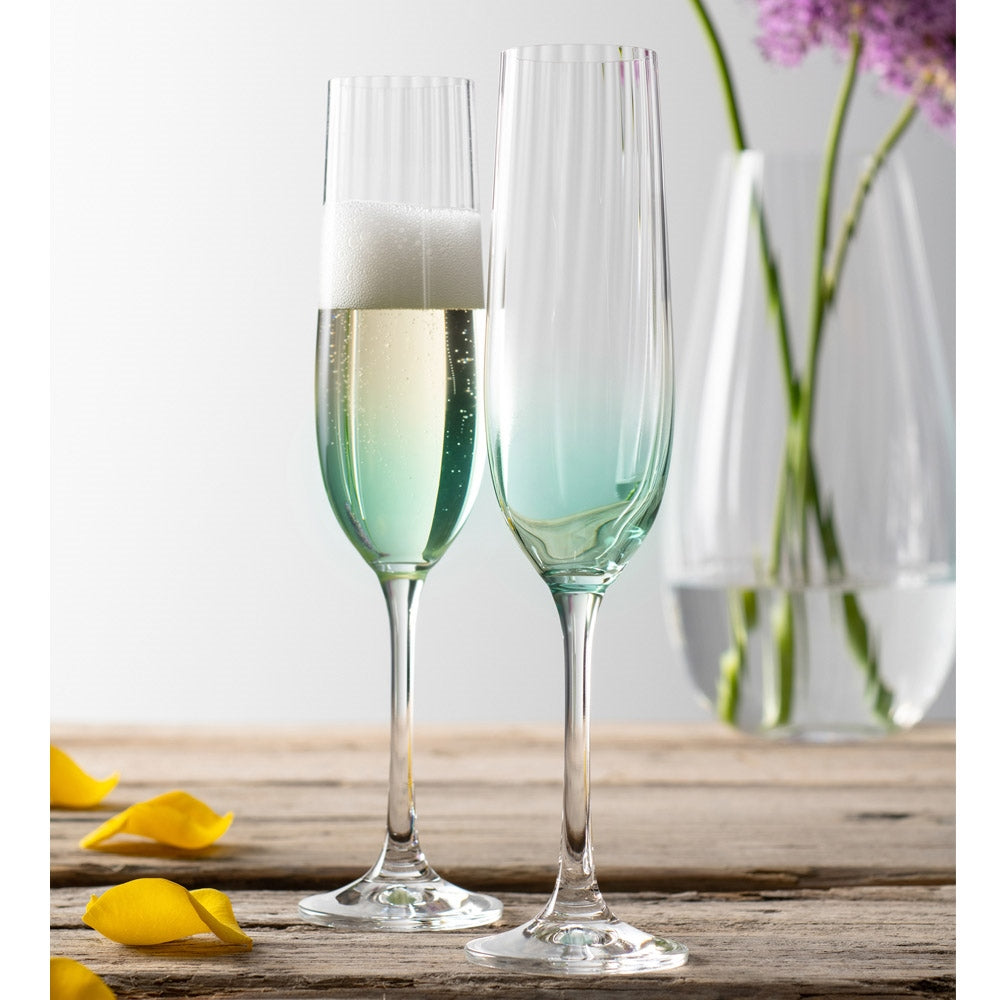 Galway Crystal Erne Champagne Flute Pair Aqua  These beautifully crafted Galway Crystal flute glasses with a Aqua coloured base are essential glasses for your home and are designed for Champagne lovers. The elegant shape of the glass along with the Erne pattern displays light lines along the body adding a stylish and modern finish. 
