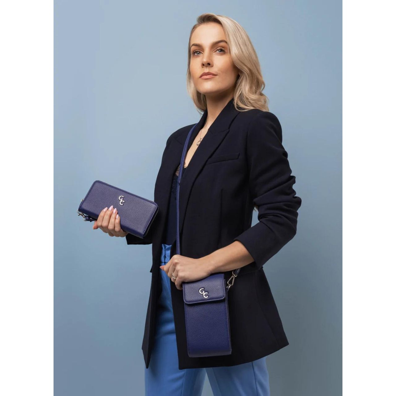 Mini Cross Bag - Navy by Galway Crystal  Introducing the new must have accessory that is truly functional. Our Light weight, Slim, Sleek, Crossbody bag is designed to hold the most essential accessory: Your mobile phone. There is nothing more liberating than carrying a lightweight bag that carries your essentials.