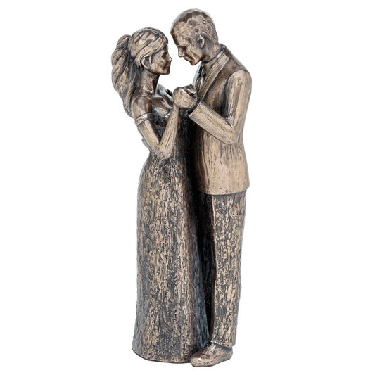 Genesis Love Always  Romantic sculpture of a couple very much in love. This beautiful sculpture is made with wonderful attention to detail and would make a fantastic gift for a loved one.  Genesis Fine Arts has evolved into a much loved and world famous Irish brand to produce a striking range of handcrafted cold cast bronze sculptures.