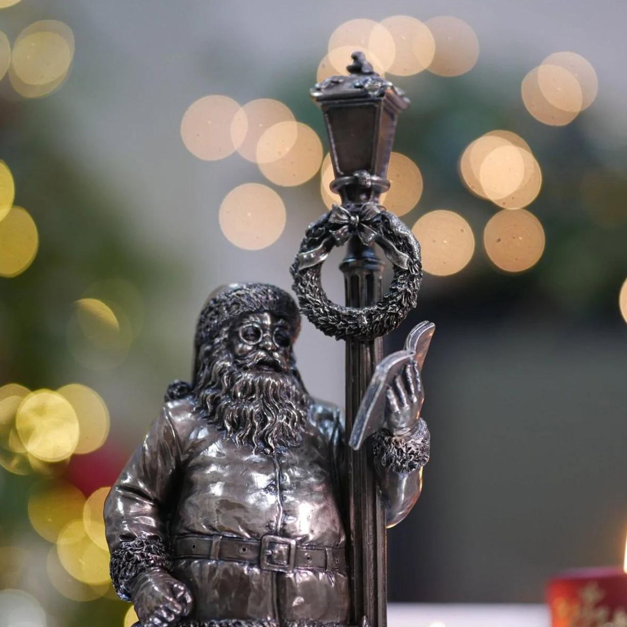 Genesis Ireland Santa's Check List  A stunning ornament that is sure to bring festive cheer to your home, beautiful bronze coloured Christmas decoration, by Genesis Ireland.  Depicting Santa Claus checking his list before setting of on Christmas Eve. Have you been Naughty or Nice? Let the magic of Christmas fill your home with this gorgeous sculpture for many years to come.