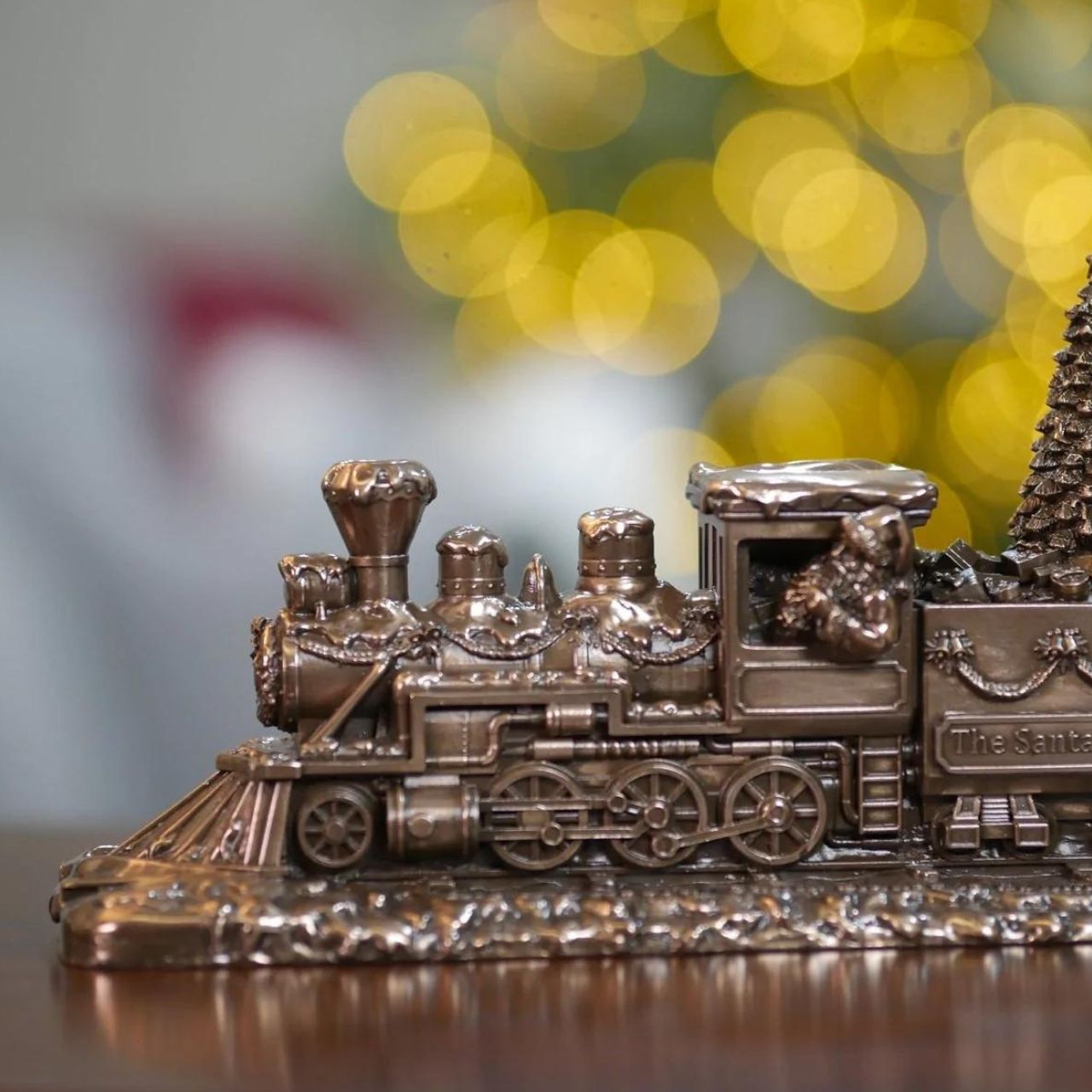 Genesis Ireland The Santa Express Train   A stunning ornament that is sure to bring festive cheer to your home, beautiful bronze coloured Christmas decoration, by Genesis Ireland.  Depicting Santa Claus on his way to delivery all the presents on Christmas Eve. Let the magic of Christmas fill your home with this gorgeous sculpture of The Santa Express.