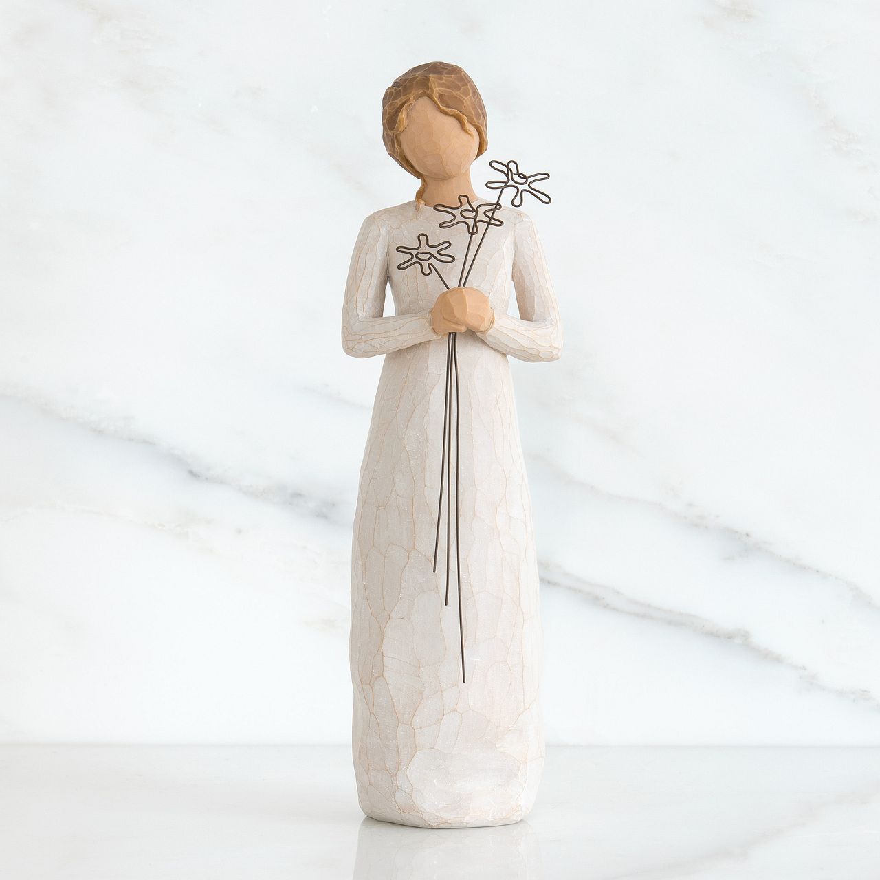 Grateful by Willow Tree  Willow Tree is an intimate line of figurative sculptures representing sentiments of love, closeness, healing, courage, hope...all the emotions we encounter in life. Artist Susan Lordi hand carves the original of each Willow Tree sculpture. Pieces are made in cast stone from her original carvings, and then individually painted by hand with lead-free paint.