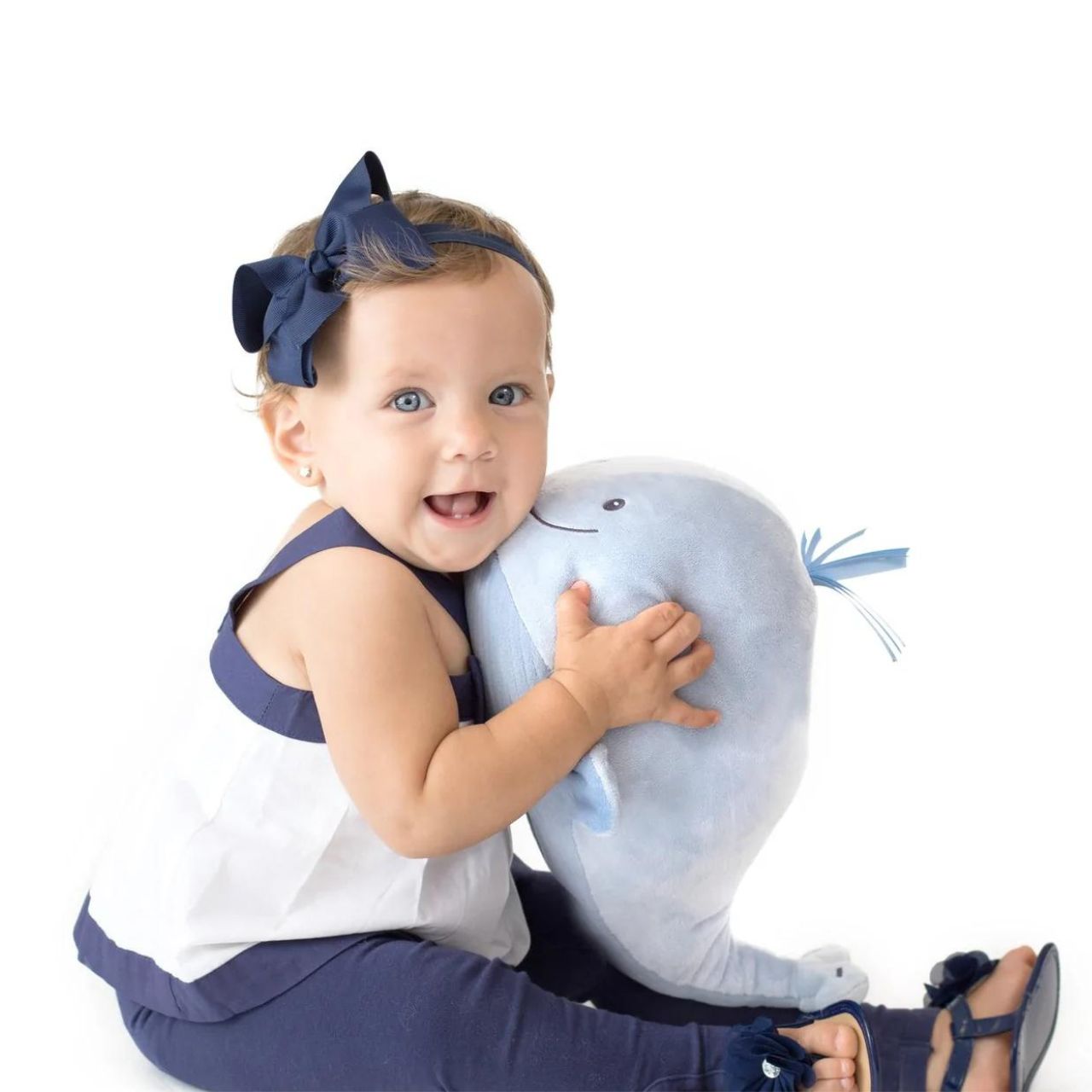 GUND Baby Sleepy Seas Light & Sound Whale  This musical plush toy will help your babies drift off to sleep. The whale is presented in an oh-so-soft light blue fabric, with blue ribbons for its hair, and dark embroidery creating a smiling face. Press the left fin and the animated whale splashes into life. 