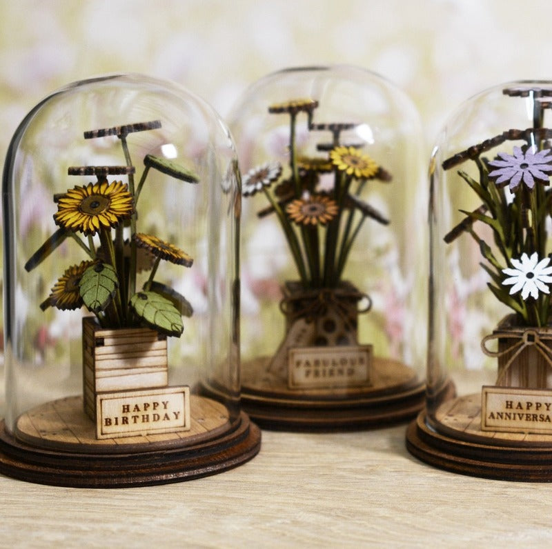 Happy Birthday Flower Figurine  Because everyone loves flowers on their Birthday. This eco-friendly glass dome decoration encases a bunch of stunning yellow flowers, adorned with a Happy Birthday plaque. 