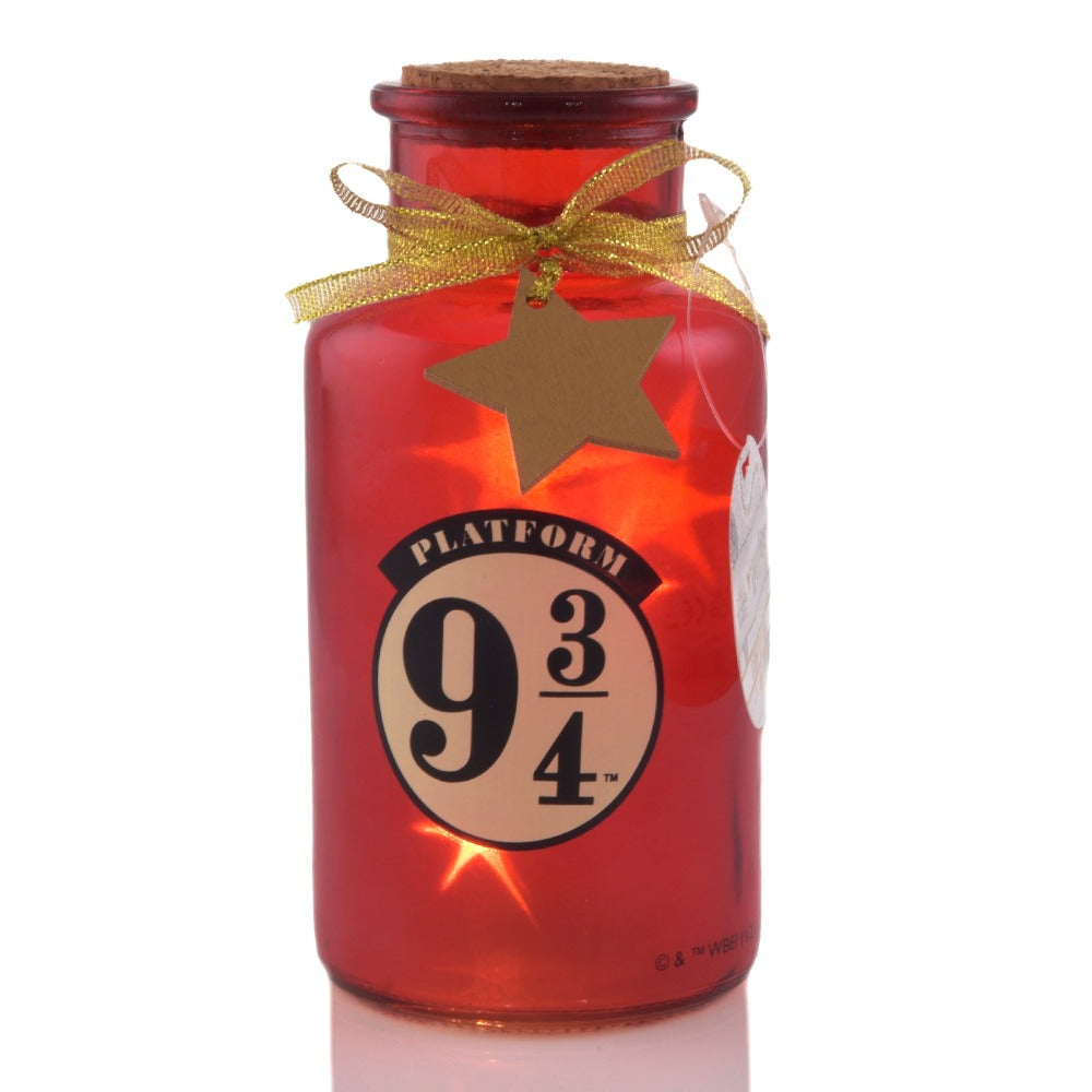 Harry Potter LED Light Up Jar Platform 9 3/4  Lumos maxima! Light up your home this Christmas with this LED glass jar light. With a glitter design, this fun accessory is sure to kick off your magical journey to Hogwarts.