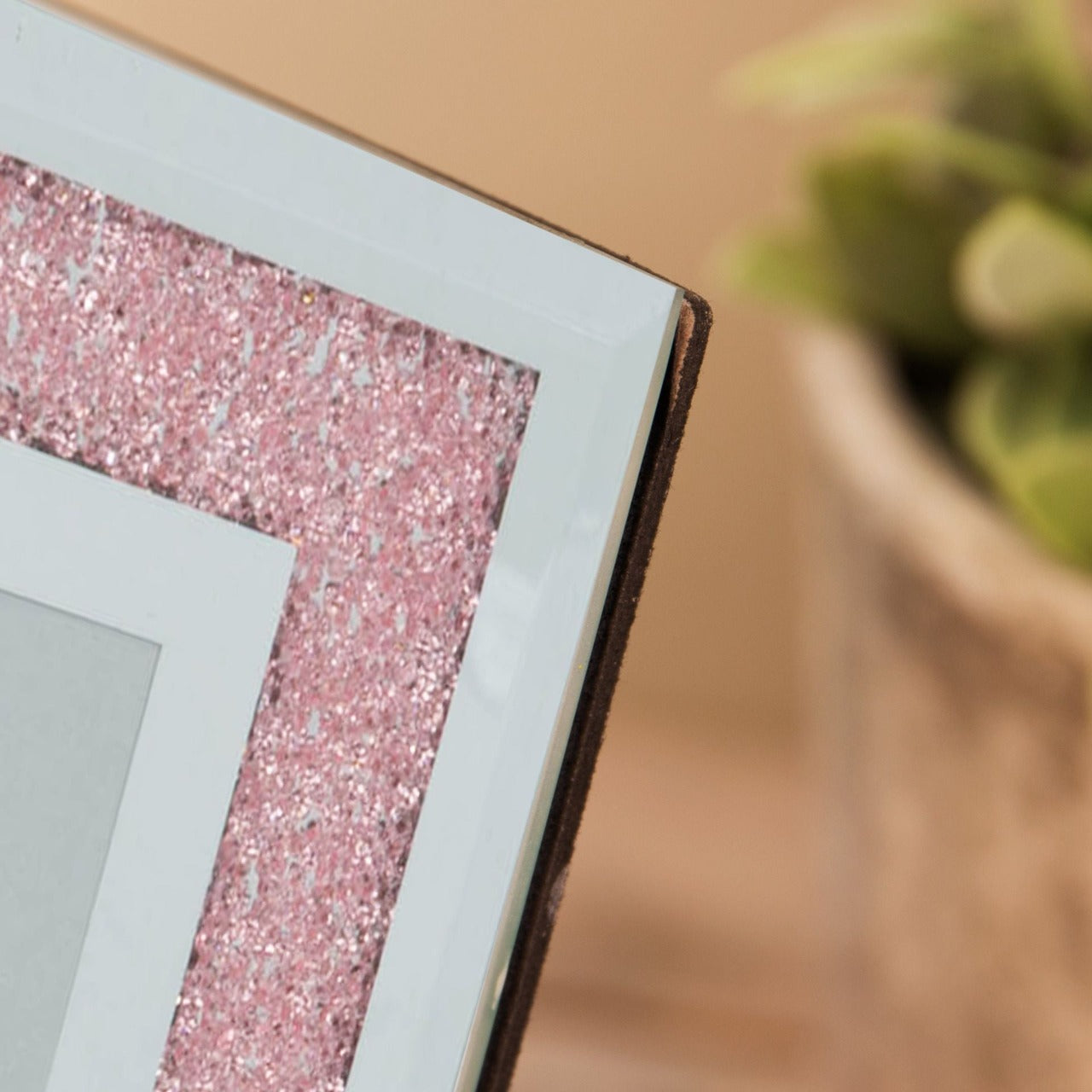 HESTIA Mirror & Blush Crystal Glass Picture Frame 4" x 6"  A mirror and blush crystal, 4" x 6" portrait photo frame, with blush pink crystal detailing. This contemporary photo frame brings a modern twist on the classic glass frame design.