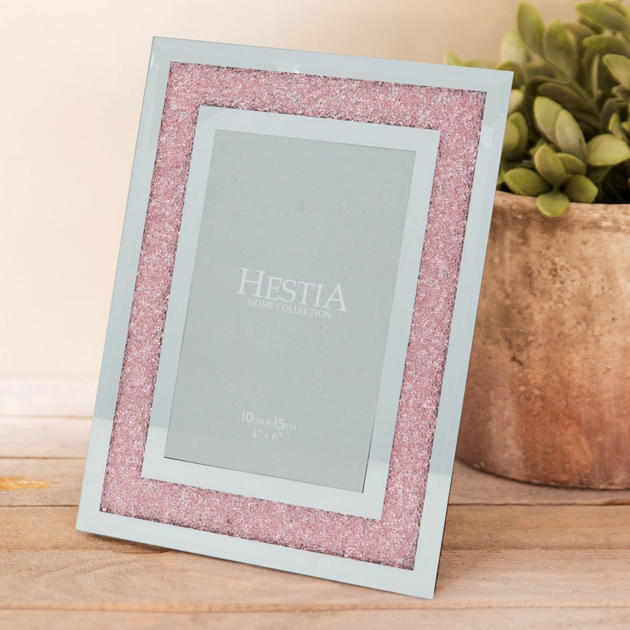 HESTIA Mirror & Blush Crystal Glass Picture Frame 4" x 6"  A mirror and blush crystal, 4" x 6" portrait photo frame, with blush pink crystal detailing. This contemporary photo frame brings a modern twist on the classic glass frame design.
