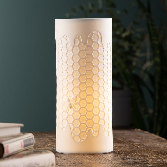 Honey Hive Luminaire by Belleek Living  The Honey Hive Luminaire features beautifully modelled details, with a hexagon hive pattern and a little embossed bee. Belleek Living Luminaire lamps emit a soft warm glow highlighting the delicate surface decoration, creating beautiful mood lighting for your home.