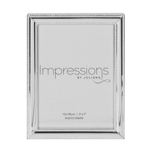 IMPRESSIONS Silver Plated Beaded Edge Photo Frame 5" x 7"  A beautifully simple silver plated photo frame with beaded edge detail and 5" x 7" aperture from IMPRESSIONS® by Juliana. Complete with luxury black velveteen standing strut.