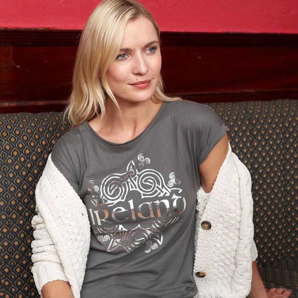 Women's Ireland Celtic Hologram T-Shirt Pewter Silver  This pewter silver T-shirt features intricate Celtic details, perfect for expressing one's Irish heritage.