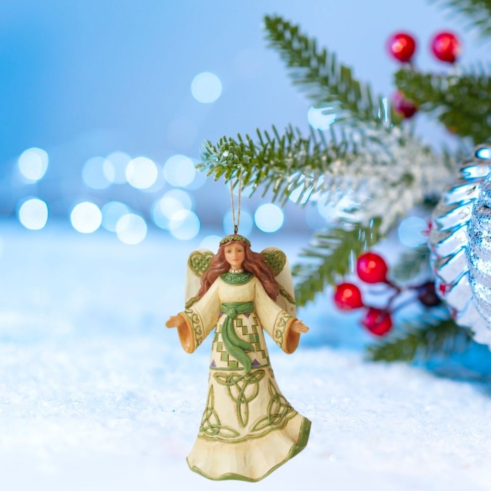 Jim Shore Heartwood Creek Irish Angel Hanging Ornament  This angel wears Celtic symbols upon her dress and wings. Wearing a halo made of green, she's equipped with Irish luck and God's grace. 