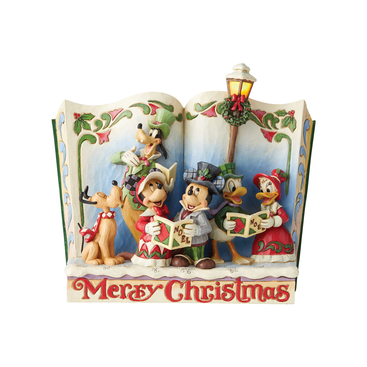 Jim Shore Merry Christmas (Christmas Carol Storybook)  Mickey and friends joyfully celebrate the season by caroling throughout the town. This festive piece by Jim Shore combines the magic of Disney with time-honored motifs of handcrafted folk art. 