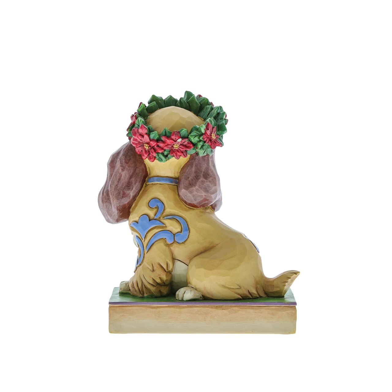 Jim Shore Christmas Lady Personality Pose Figurine  Lady, the regal Cocker Spaniel, wears a crown of holly in this lovely relief by Jim Shore. Her classic blue collar is matched by gorgeous rosemaling running down her coat.