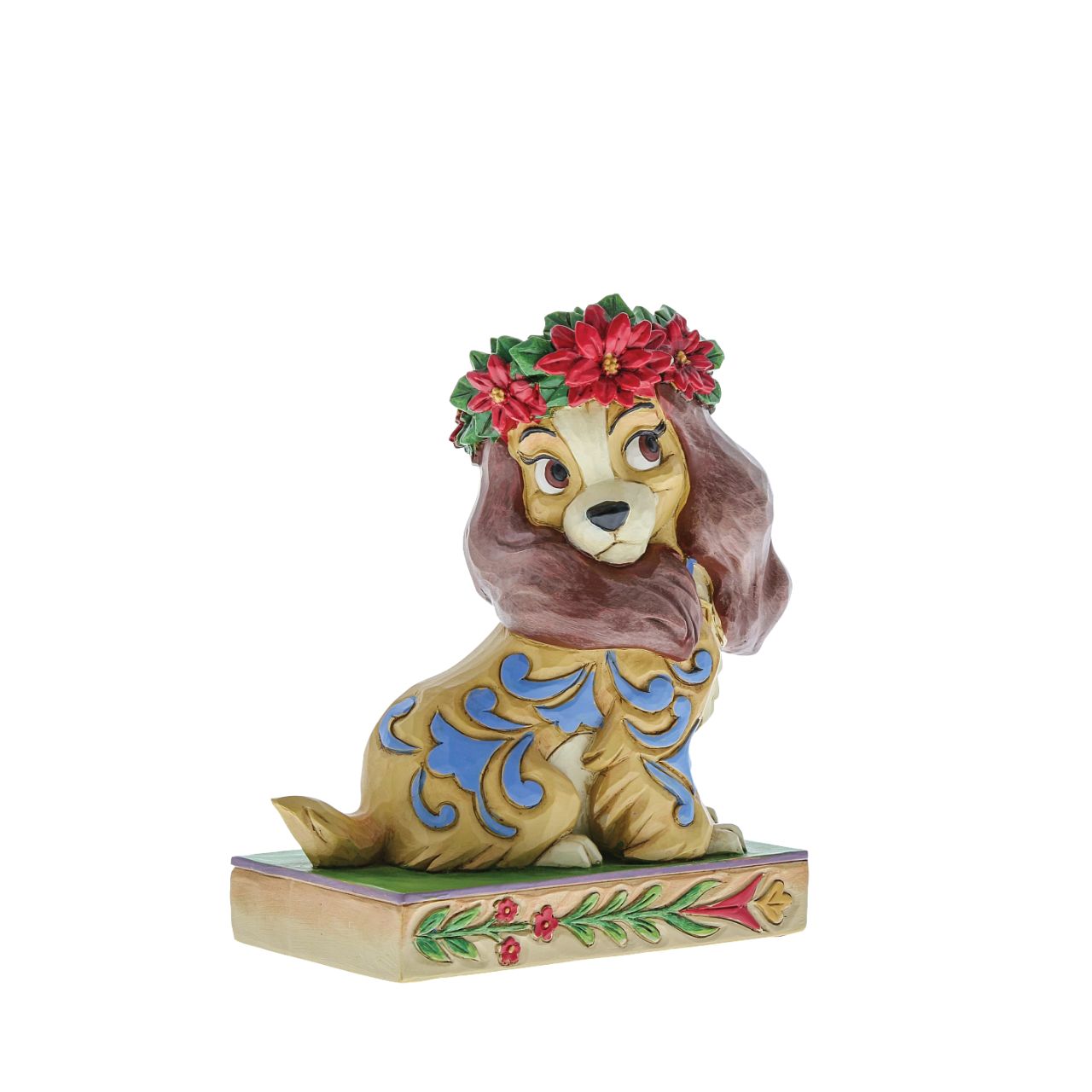 Jim Shore Christmas Lady Personality Pose Figurine  Lady, the regal Cocker Spaniel, wears a crown of holly in this lovely relief by Jim Shore. Her classic blue collar is matched by gorgeous rosemaling running down her coat.