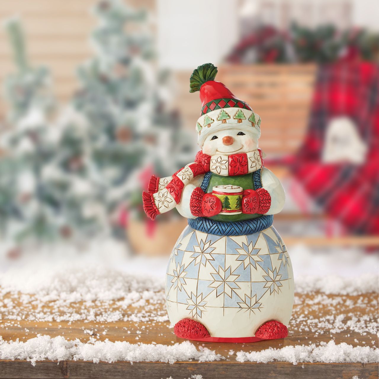 Jim Shore Cozy Snowman Figurine  Brightly Dressed in his warm winter wear this 2022 Hallmark Exclusive snowman enjoys a delicious steaming cup of cocoa with marshmallows on top to shield against the winter chill.