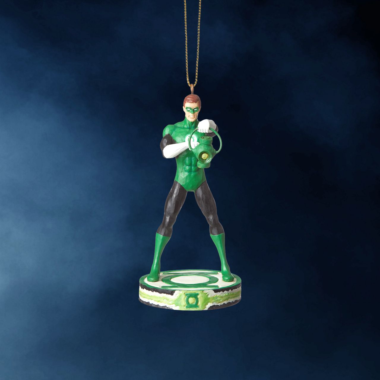 DC Comics By Jim Shore Green Lantern Christmas Hanging Ornament  DC Comics Justice League is a comprised of the world's most iconic superheroes. Jim Shore celebrates Green Lantern in an iconic pose in his signature wood carved look and folk art styling. Sure to be a treasured gift across the generations.