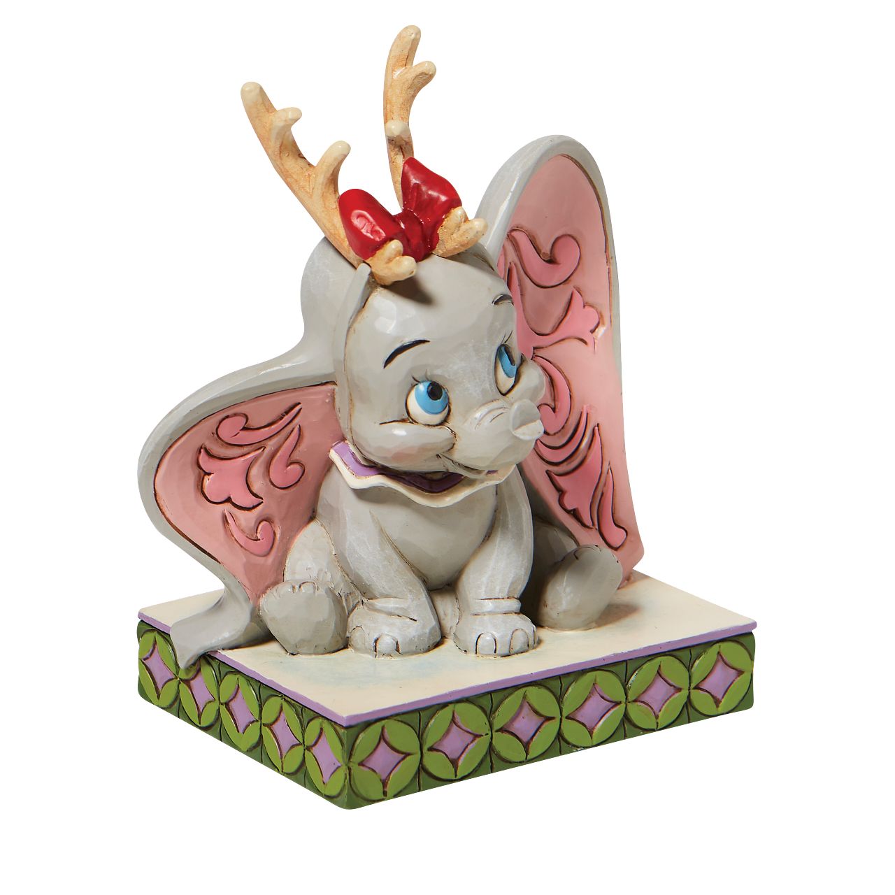 Jim Shore Santa's Cheerful Helper - Flying Dumbo as a Reindeer Figurine  "Santa's Cheerful Helper" Dumbo, the sweetest elephant with the largest ears, dons antlers to help deliver presents this season. Already gifted with the power of flight, he'll make a lovely reindeer for Santa's sleigh in this Jim Shore classic.