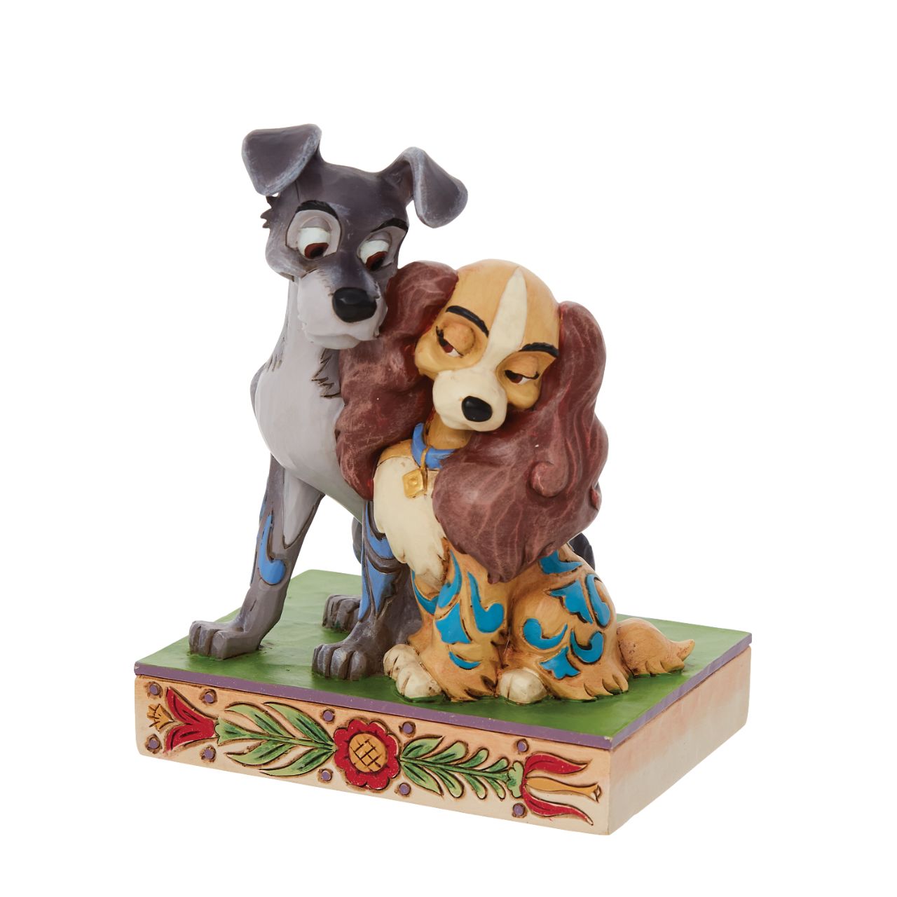 Jim Shore Disney Lady & the Tramp Love Figurine  With a love story as pure as gold, this pair of precious pups snuggle together sweetly. With intricate Jim Shore rosemaling and inspiring intimacy, this Lady and the Tramp piece steals hearts. This enchanting piece is a charming addition to any room.