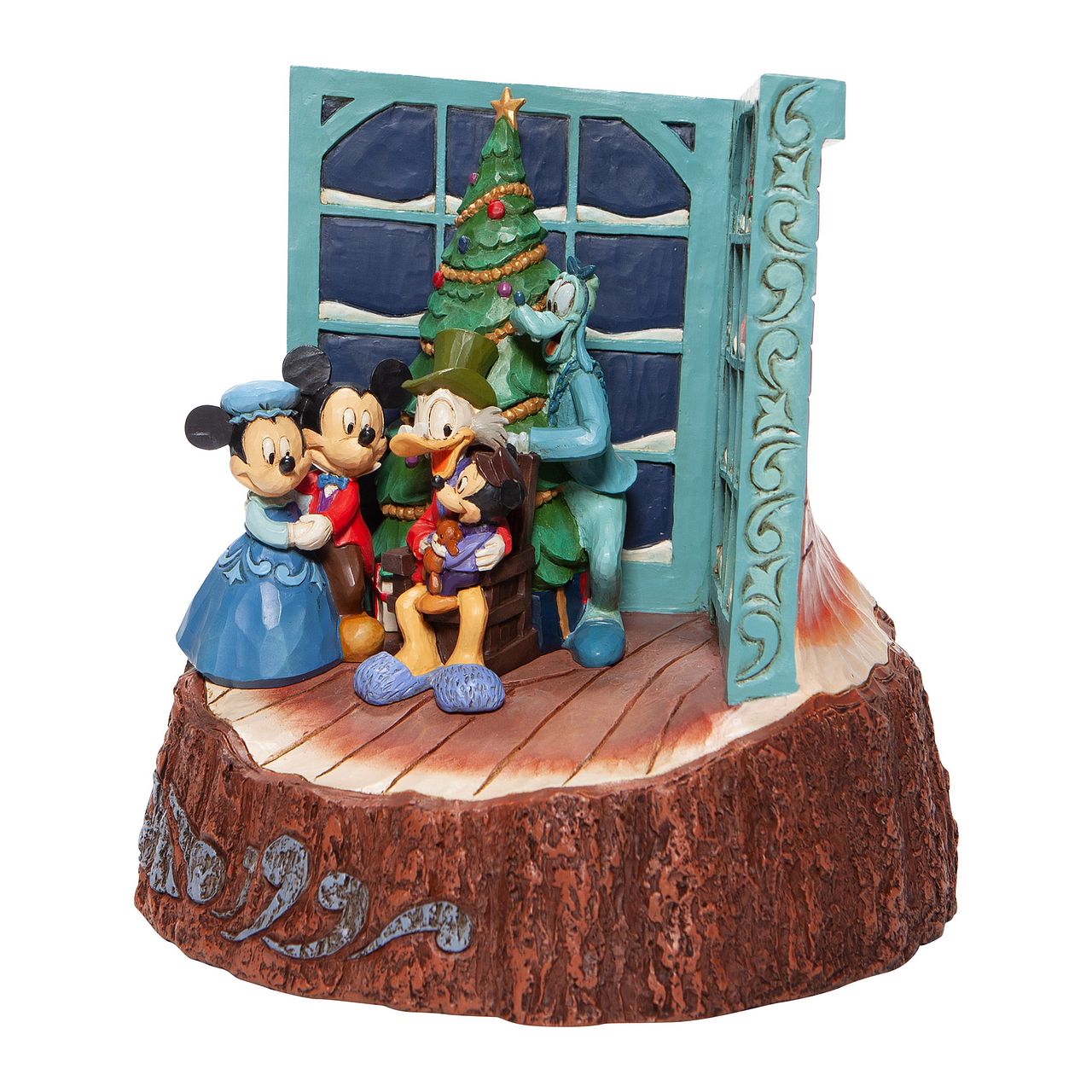 Jim Shore Mickey Mouse Christmas Carol Carved by Heart Figurine  Mickey and family gather around the tree to witness a Christmas Carol retelling by Scrooge McDuck. With windows alight with narrative imagery, they're in for a treat celebrating Christmas past, present and future in this nostalgic design by Jim Shore.