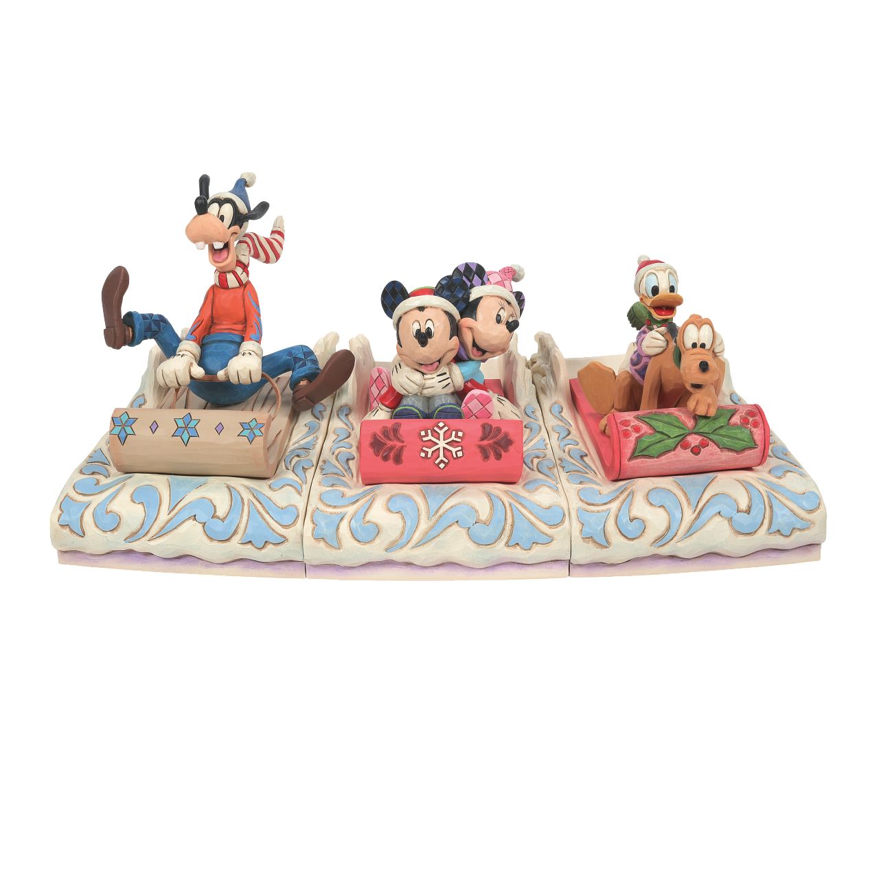 Disney Traditions Jim Shore Donald and Pluto Sledding  This pair prepares for a high velocity ride down Christmas Mountain. Bundled up, Donald grabs hold of Pluto for extra support as their sled coasts through the snow covered scenery in this Jim Shore design. With friends like these, winter is warmer.