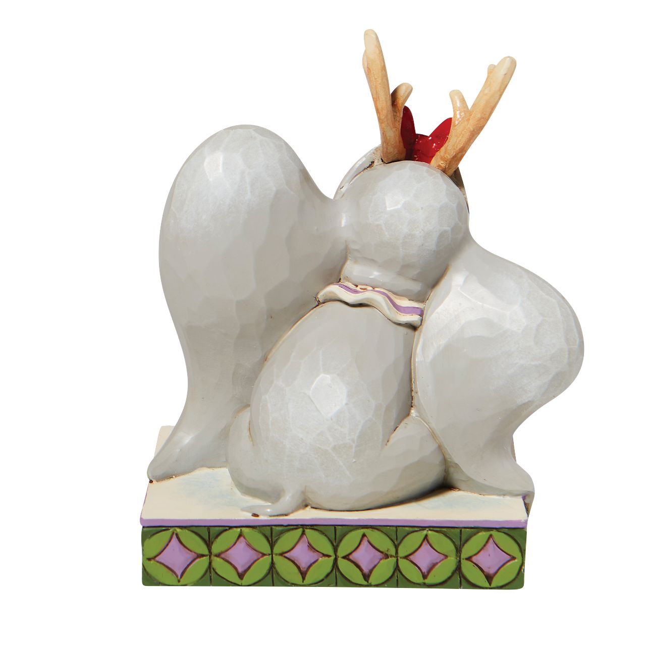 Jim Shore Santa's Cheerful Helper - Flying Dumbo as a Reindeer Figurine  "Santa's Cheerful Helper" Dumbo, the sweetest elephant with the largest ears, dons antlers to help deliver presents this season. Already gifted with the power of flight, he'll make a lovely reindeer for Santa's sleigh in this Jim Shore classic.