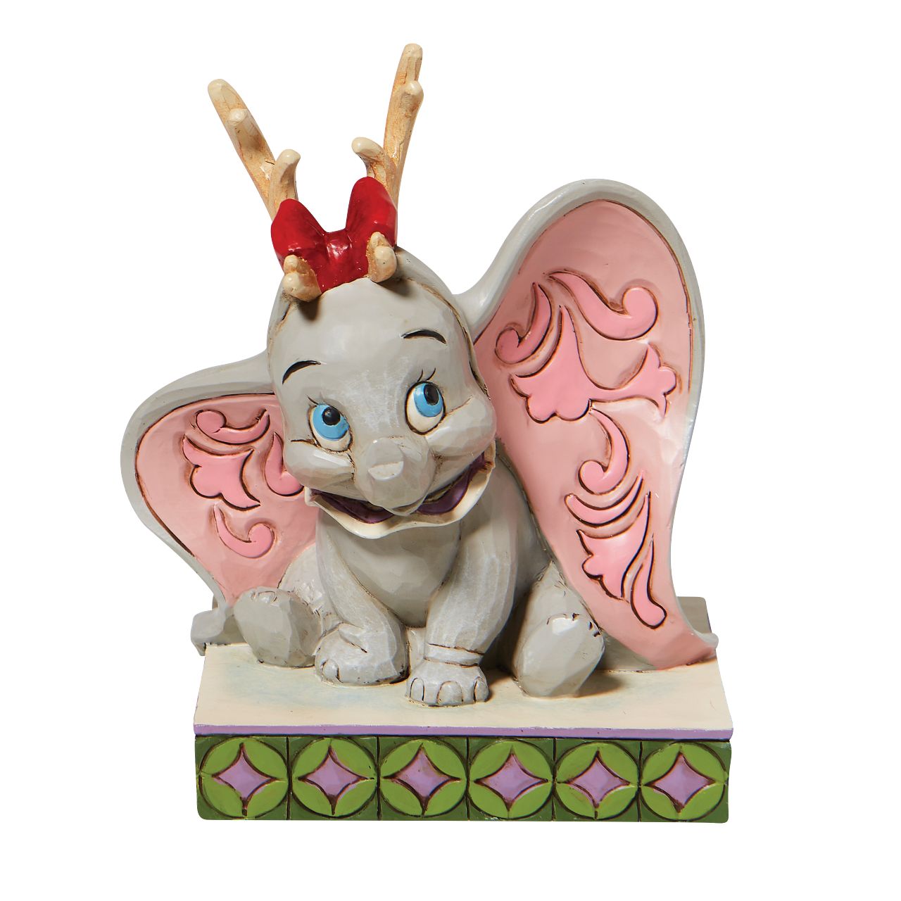Jim Shore Santa's Cheerful Helper - Flying Dumbo as a Reindeer Figurine  "Santa's Cheerful Helper" Dumbo, the sweetest elephant with the largest ears, dons antlers to help deliver presents this season. Already gifted with the power of flight, he'll make a lovely reindeer for Santa's sleigh in this Jim Shore classic.