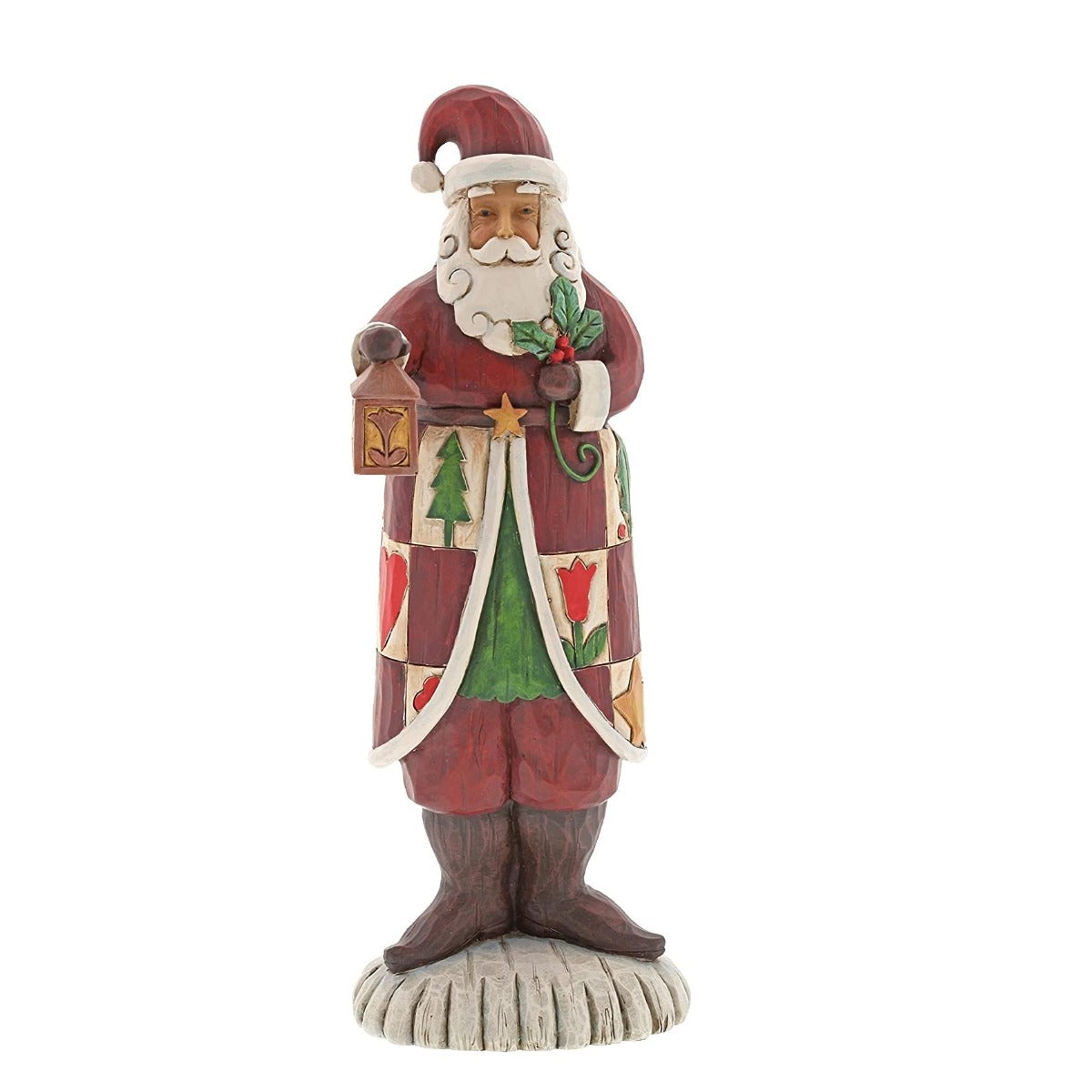 Jim Shore Heartwood Creek Folklore Santa With Lantern  The Folklore collection features Jim Shore's signature colour palette and heartfelt, rustic design. Cloaked in a charming patchwork of quaint holiday symbols, this handcrafted Santa holds a traditional lantern and cheery sprig of holly.