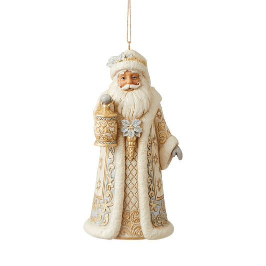 Jim Shore Holiday Lustre Santa Hanging Ornament  Santa sparkles in this holiday ornament by Jim Shore. Holding a lantern and cloaked in a striking suit fitted with metallic accents, Santa shines this season. With a smile and glittering poinsettias, Father Christmas radiates joy.
