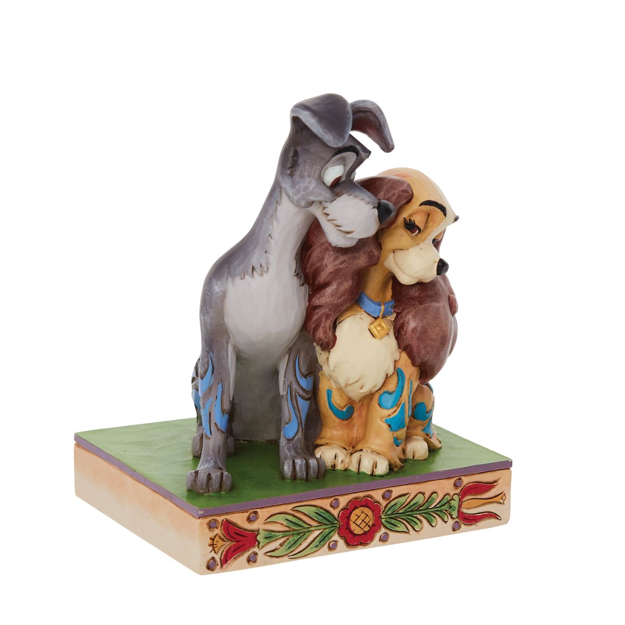 Jim Shore Disney Lady & the Tramp Love Figurine  With a love story as pure as gold, this pair of precious pups snuggle together sweetly. With intricate Jim Shore rosemaling and inspiring intimacy, this Lady and the Tramp piece steals hearts. This enchanting piece is a charming addition to any room.