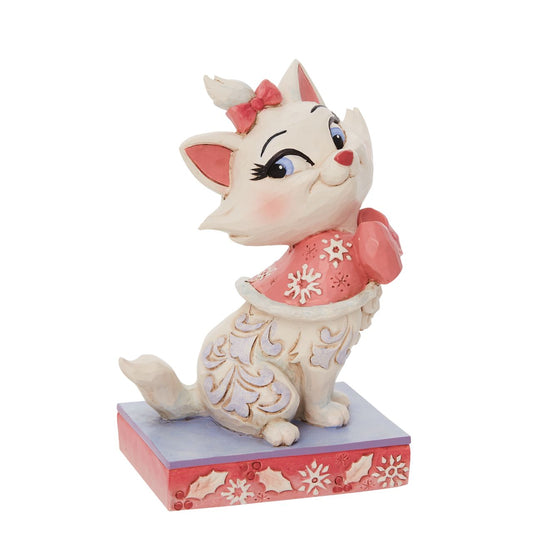 Jim Shore Marie Christmas Figurine  Marie is the princess of the Aristocats family. Looking lavish in her bows, she wears a pink cape fitted in snowflakes. Delicate Jim Shore blue rosemaling runs down her lovely coat.