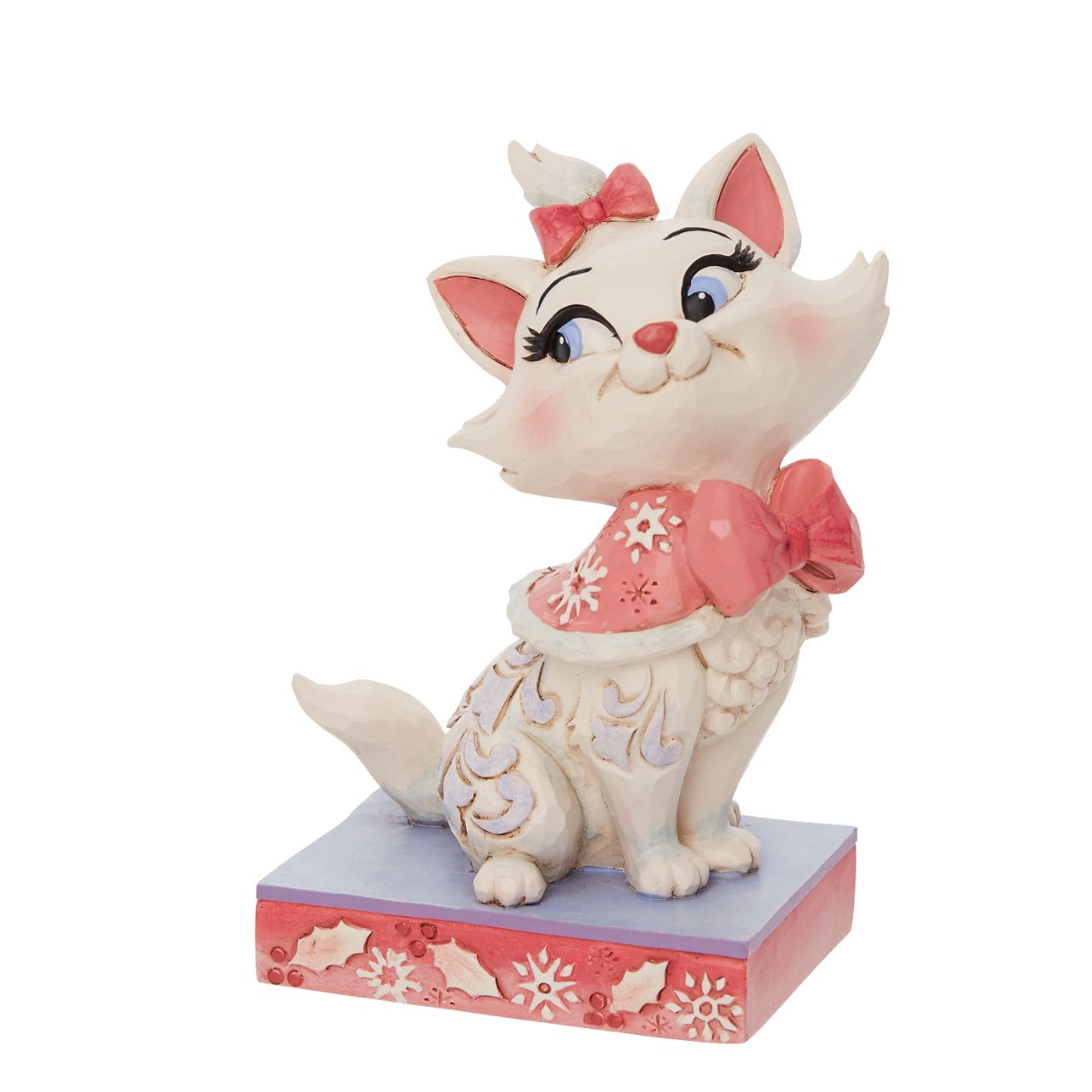 Jim Shore Marie Christmas Figurine  Marie is the princess of the Aristocats family. Looking lavish in her bows, she wears a pink cape fitted in snowflakes. Delicate Jim Shore blue rosemaling runs down her lovely coat.