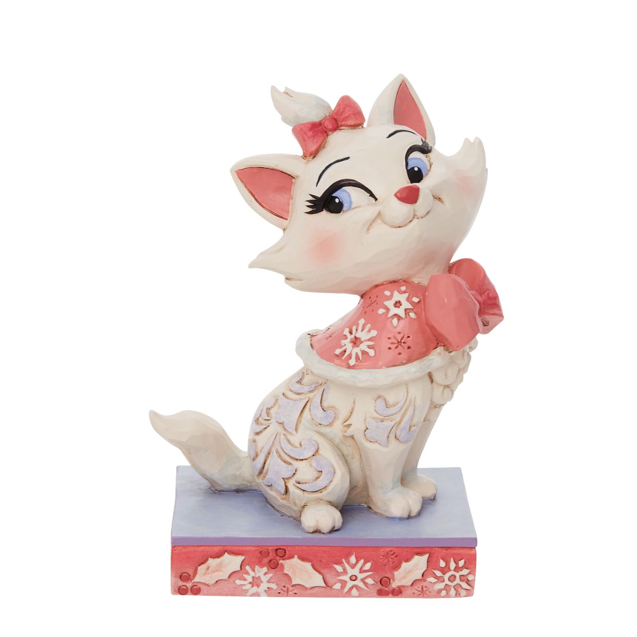 Jim Shore Marie Christmas Figurine  Marie is the princess of the Aristocats family. Looking lavish in her bows, she wears a pink cape fitted in snowflakes. Delicate Jim Shore blue rosemaling runs down her lovely coat.