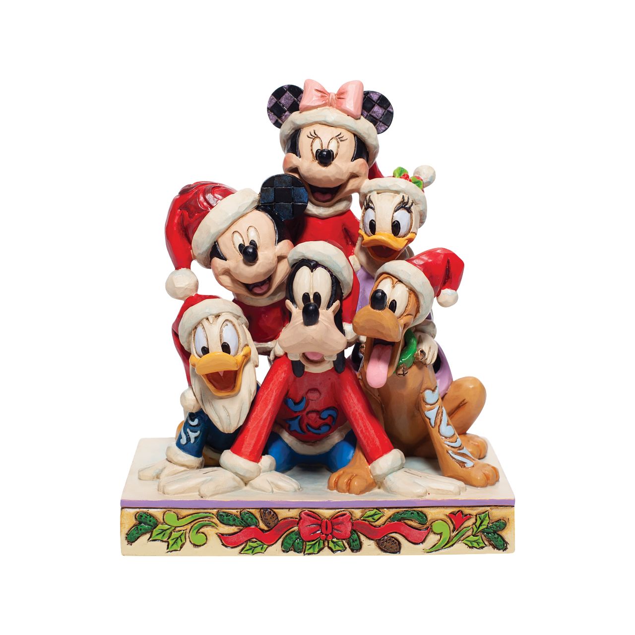 Jim Shore Christmas Mickey and Friends Stacked Figurine  Stacked in a holiday pyramid, Mickey and pals savour a day in the snow. Each wearing a Santa hat, they've discovered the meaning of Christmas and enjoy jolly laughs surrounded by friends. Jim Shore creates a scene sandwiched with nostalgia and love.
