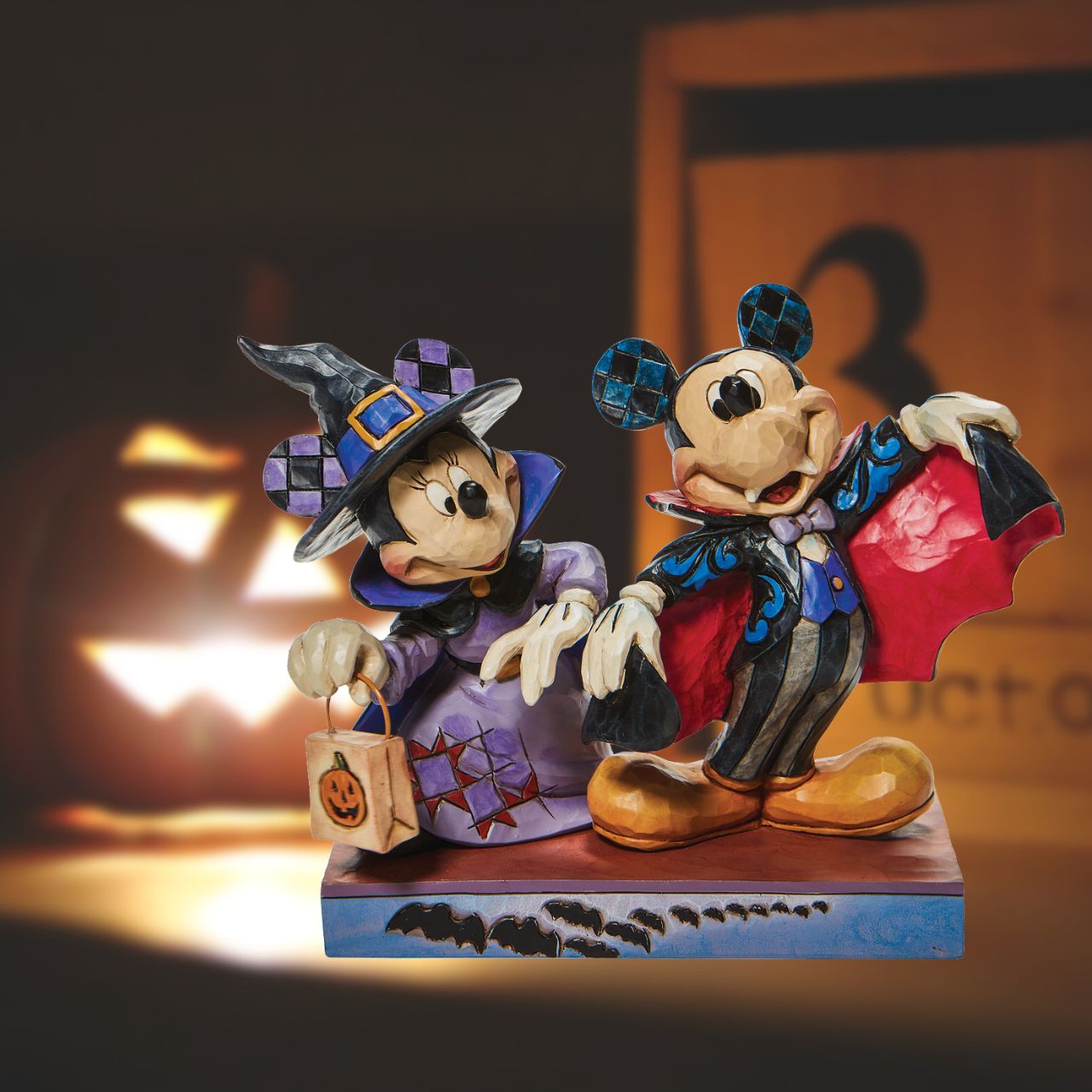 Disney Terrifying Trick-or-Treaters - Mickey and Minnie as a Vampires  This delightful double figurine is the perfect gift for any Disney fan this Halloween. Seeing a mouse might make you jump, but two in costume will make you smile in this Jim Shore design. Mickey and Minnie don some spooky suits for the sake of Halloween.