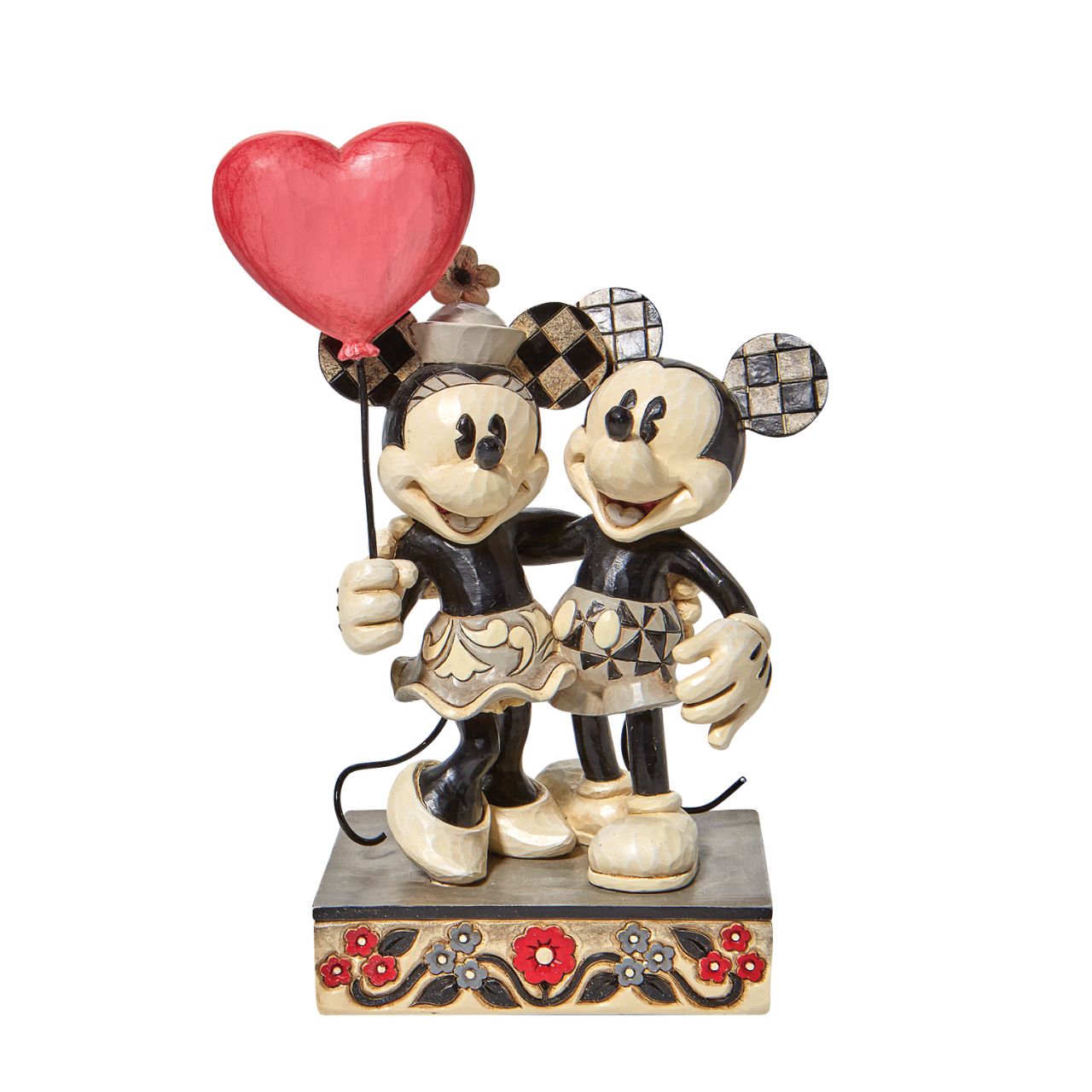 Jim Shore Disney Mickey and Minnie Heart Figurine  "Love is in the Air" Celebrate love with the original Disney couple with this sweet relief by Jim Shore. Mickey Mouse hugs his girl close in this romantic figurine with classic Jim Shore rosemaling. Minnie holds on tight to a heart balloon and her valentine.