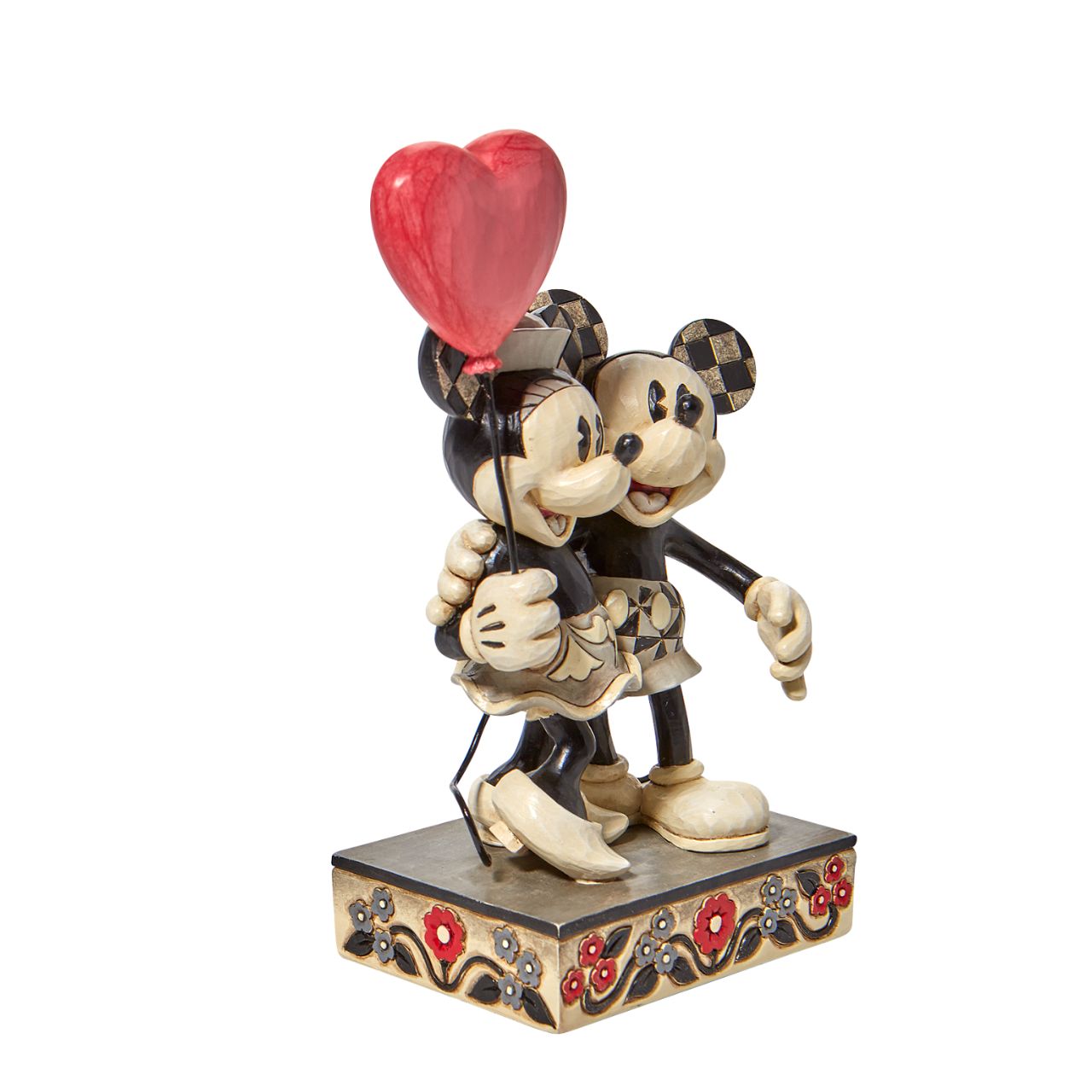 Jim Shore Disney Mickey and Minnie Heart Figurine  "Love is in the Air" Celebrate love with the original Disney couple with this sweet relief by Jim Shore. Mickey Mouse hugs his girl close in this romantic figurine with classic Jim Shore rosemaling. Minnie holds on tight to a heart balloon and her valentine.