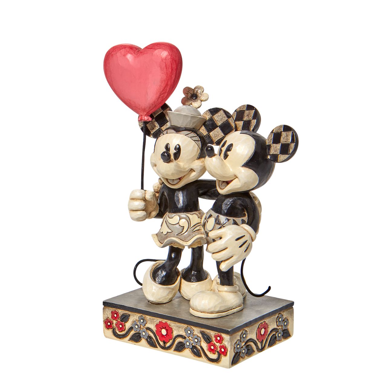 Jim Shore Disney Mickey and Minnie Heart Figurine  "Love is in the Air" Celebrate love with the original Disney couple with this sweet relief by Jim Shore. Mickey Mouse hugs his girl close in this romantic figurine with classic Jim Shore rosemaling. Minnie holds on tight to a heart balloon and her valentine.