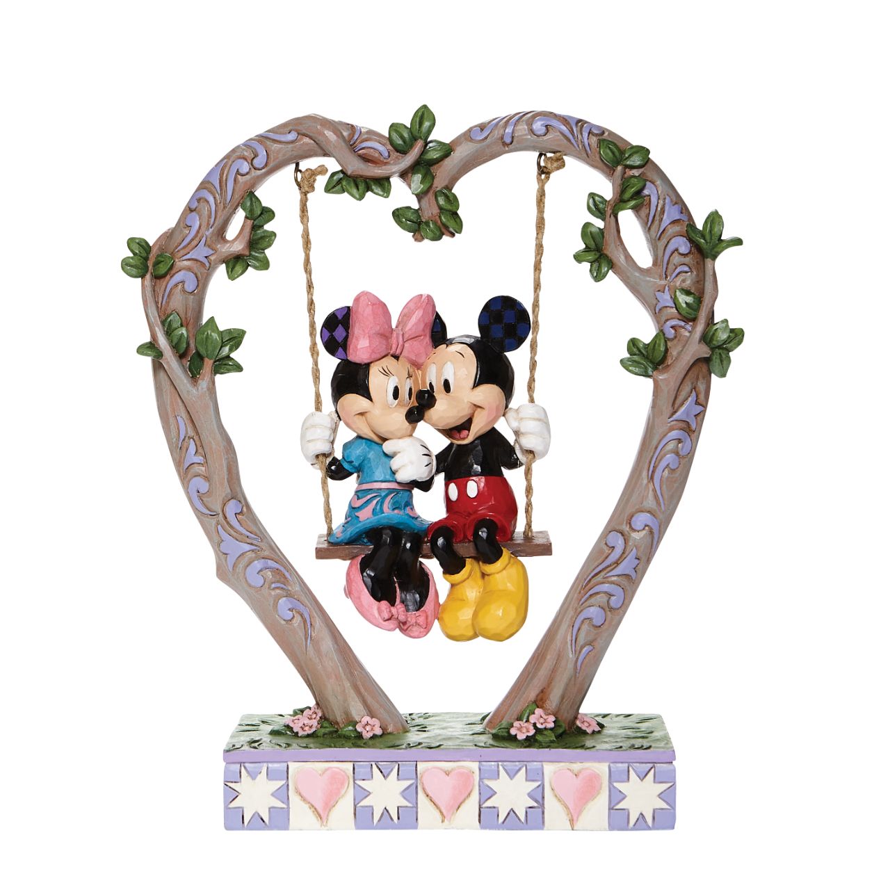 Jim Shore Sweethearts in Swing - Mickey and Minnie on Swing Figurine  Suspended from a heart-shaped branch, a smitten Mickey and Minnie swing into Spring in this quintessentially romantic Jim Shore sculpture.
