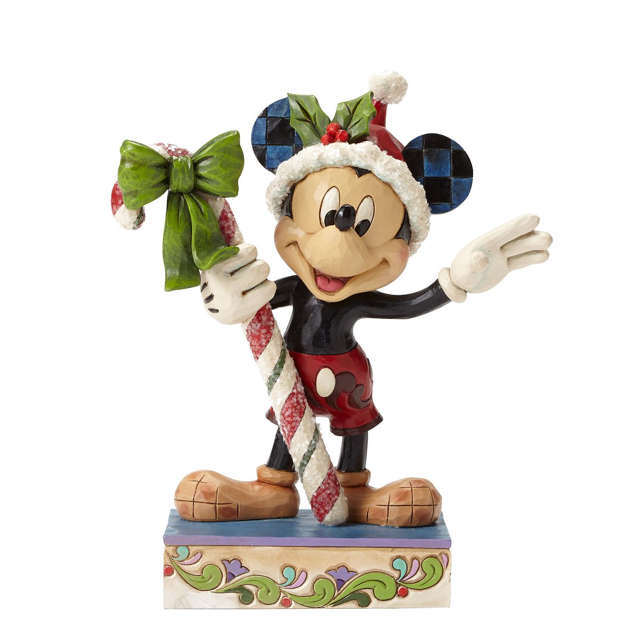 Disney Mickey Mouse Candy Cane Figurine  "Sweet Greetings" A jolly Mickey Mouse brings a gift of sugar coated candy in this delightful Christmas design from the artistry of Jim Shore. Beautifully handcrafted, this eye-catching piece features the classic Disney character decorated in Jim's unique folk art style.