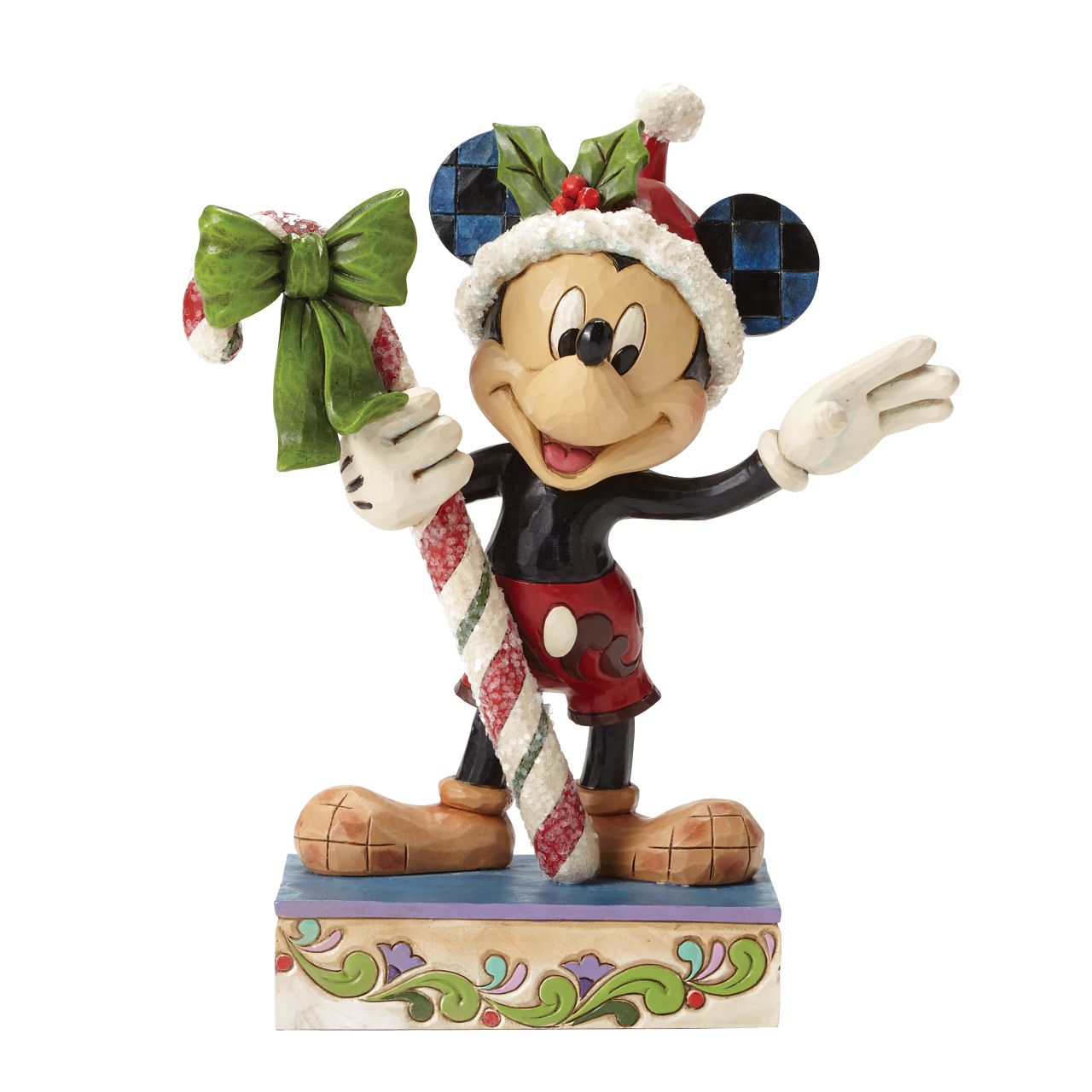 Disney Mickey Mouse Candy Cane Figurine  "Sweet Greetings" A jolly Mickey Mouse brings a gift of sugar coated candy in this delightful Christmas design from the artistry of Jim Shore. Beautifully handcrafted, this eye-catching piece features the classic Disney character decorated in Jim's unique folk art style.