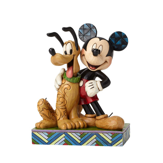 Jim Shore Best Pals - Mickey Mouse & Pluto Figurine  Dogs are a mouse's best friend! This heartfelt figurine celebrates the unconditional love Mickey and Pluto have for each other, as the duo pose with happy smiles and a cuddly stance. Handcrafted and hand-painted, this piece is a one-of-a-kind treasure.