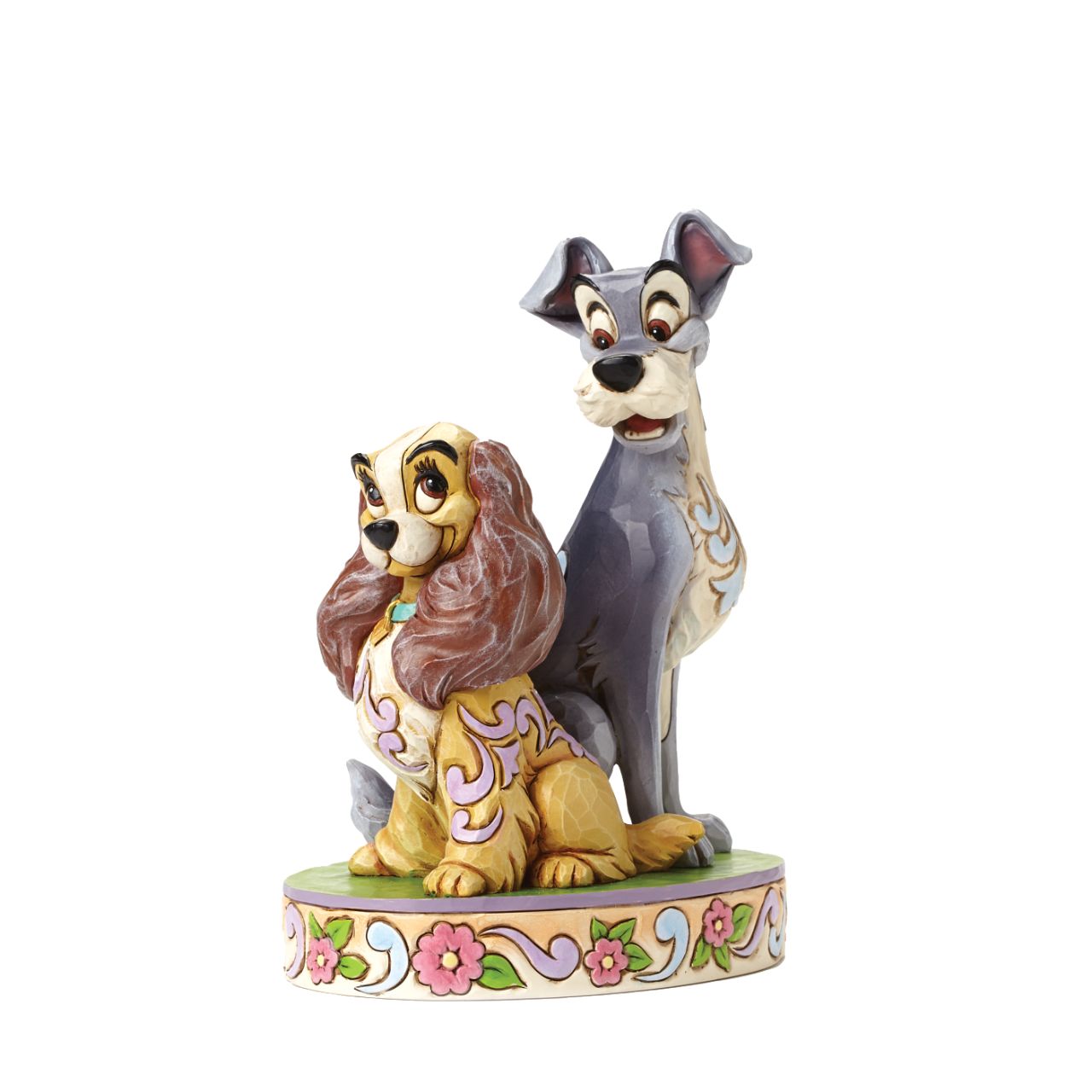 Opposites Attract Lady and The Tramp 60th Anniversary Piece  To celebrate the 60th Anniversary of Disney's romantic classic Lady and the Tramp. Jim Shore celebrates this historic milestone with a special figurine capturing the two characters in a lovable pose.