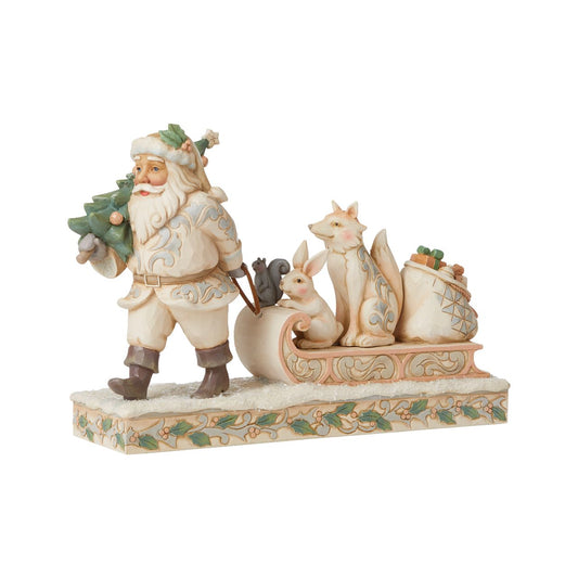 Jim Shore White Woodland Santa Pulling Sled Figurine  "A Wandering We Go" Santa is getting ready for Christmas with his furry friends. This piece features Santa dressed in the iconic, muted colours of White Woodland, whilst pulling a sled of forest animals and gifts.
