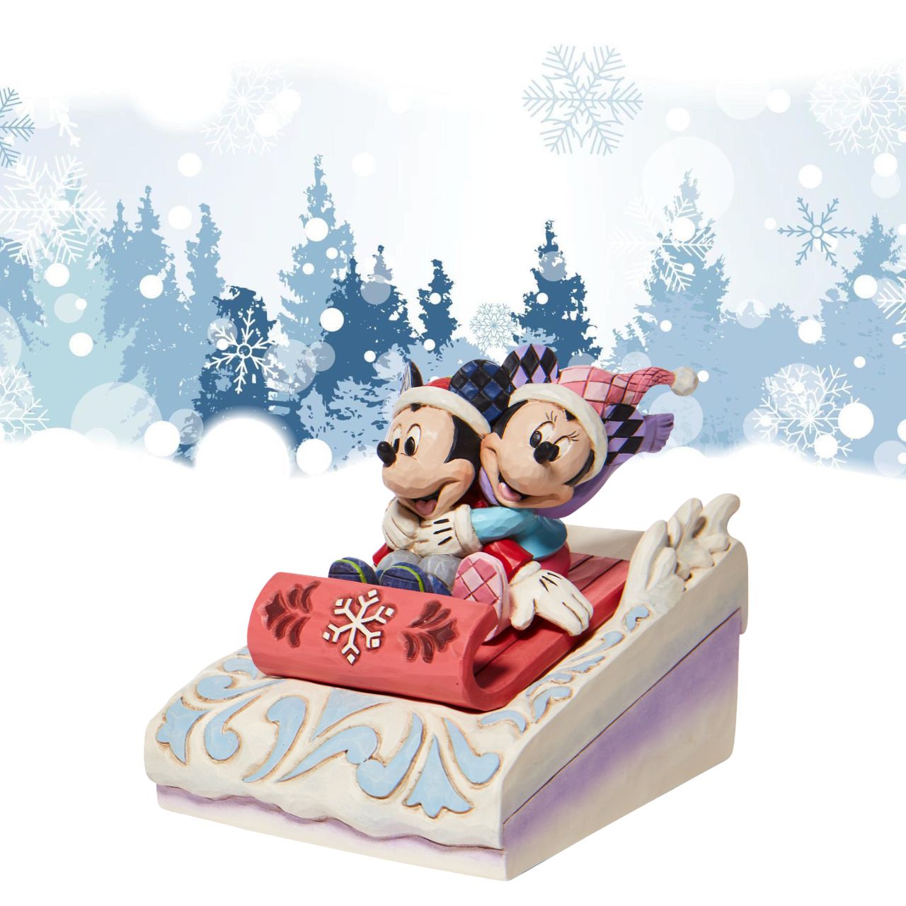 Jim Shore Disney Mickey & Minnie Sledding Figurine - Sledding Sweethearts  Couples that sleigh together, stay together. Disney's original duo embrace for a sled ride down Christmas Mountain. Holding her guy tight, Minnie clings onto Mickey as they go sliding in the snow.