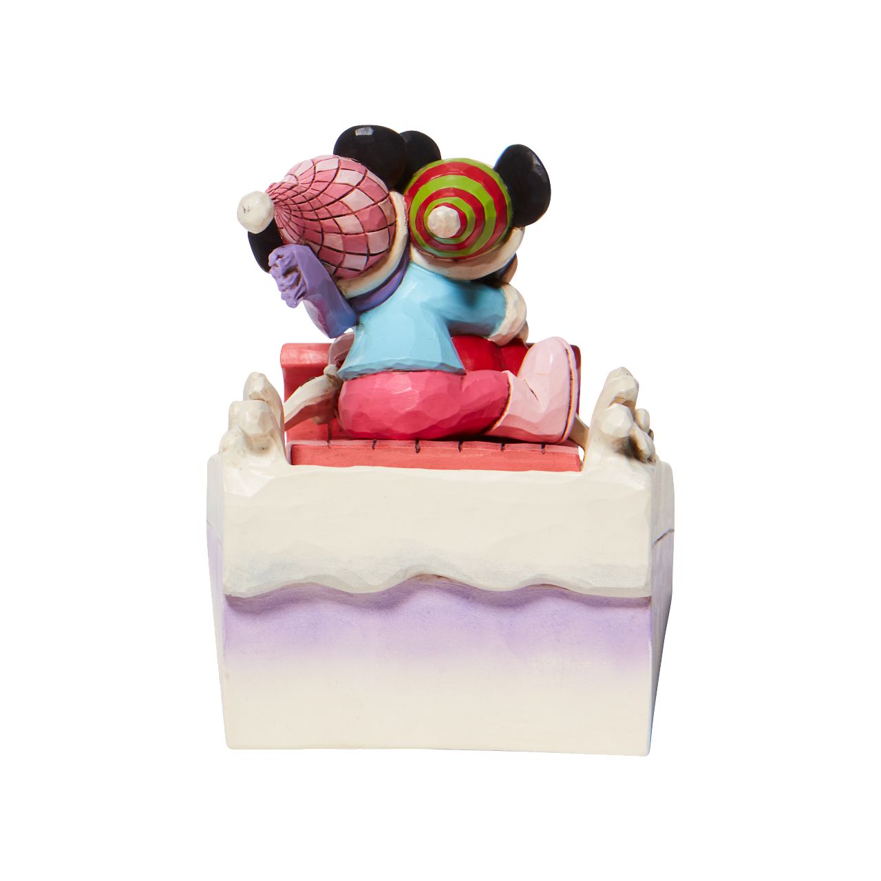 Jim Shore Disney Mickey & Minnie Sledding Figurine - Sledding Sweethearts  Couples that sleigh together, stay together. Disney's original duo embrace for a sled ride down Christmas Mountain. Holding her guy tight, Minnie clings onto Mickey as they go sliding in the snow. With folksy Jim Shore details they're a jolly pair. Hand painted and hand sculpted from cast stone.