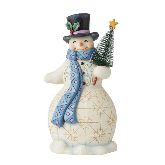 Snowman with Tree Figurine Heartwood Creek Collection  Traditional Heartwood Creek Collection; Wood carved textures and intricately detailed designs. Unique, sometimes surprising combinations of colours - often incorporating a touch of Jim's favourite colour - purple. Here this snowman cosy in his Blue and Purple Scarf looks delighted for the forthcoming festivities.