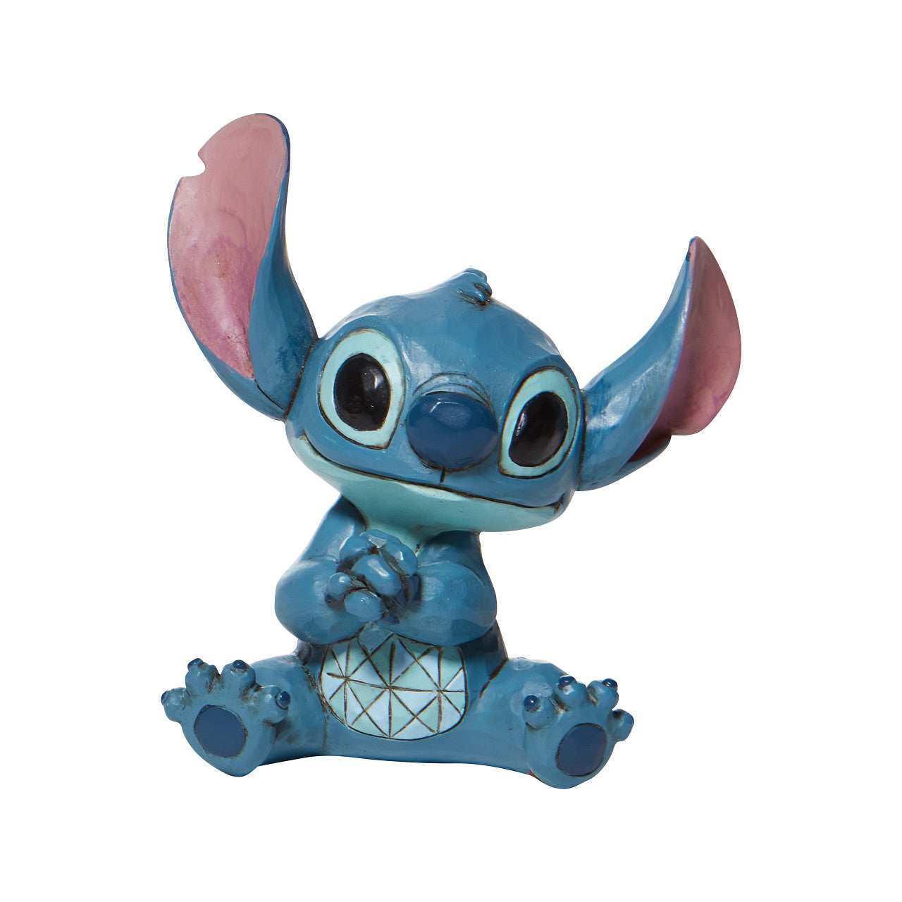 Jim Shore Stitch Mini Figurine  Everyone's favorite alien, Stitch, looks extra adorable in this mini figurine by Jim Shore. Hands clasped, the temperamental alien appears soothed in this figurine, one can only imagine he's listening to Elvis records or watching Lilo hula.